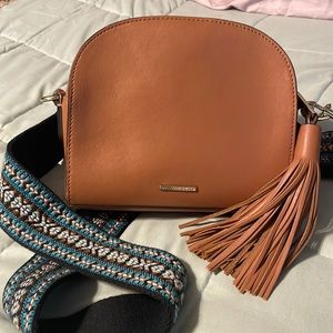 Rebecca Minkoff crossbody with guitar strap.